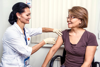 Doctor giving an injection to a patient