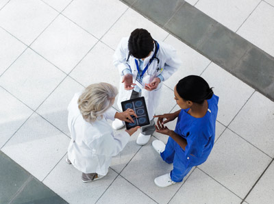 Hospital staff looking at scans