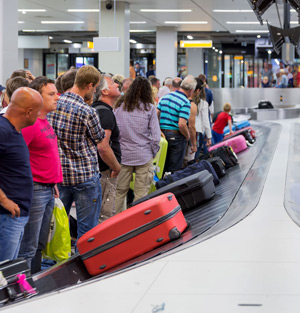 Travelers waiting for their luggages