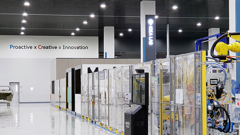 Row of glass cubicles at an engineering R&D centre.