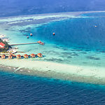 Aerial view of a vacation island resort, in Maayafushi, Maldives.